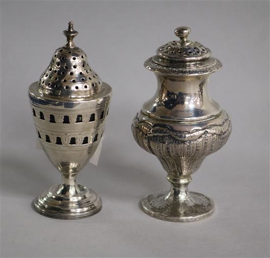 Two George III silver pepperettes.